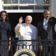 President Barack Obama, first lady Michelle Obama and Pope Francis wave during an arrival ceremony for the pope on the South Lawn of the White House in Washington, D.C., Sept. 23, 2015. More than 15,000 people packed the South Lawn for a full ceremonial welcome of Pope Francis for his first visit to the United States.
JIM WATSON/AFP/Getty Images